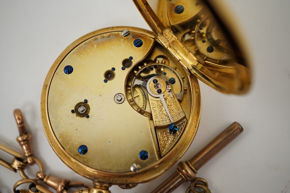 A continental 18k gold open faced keyless lever pocket watch, with a 9ct albert